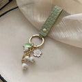Fresh And Elegant Bell Orchid Keychain For Women Green Sweet Imitation Pearl Leatherresin Alloy Keychain Jewelry Accessory Gifts