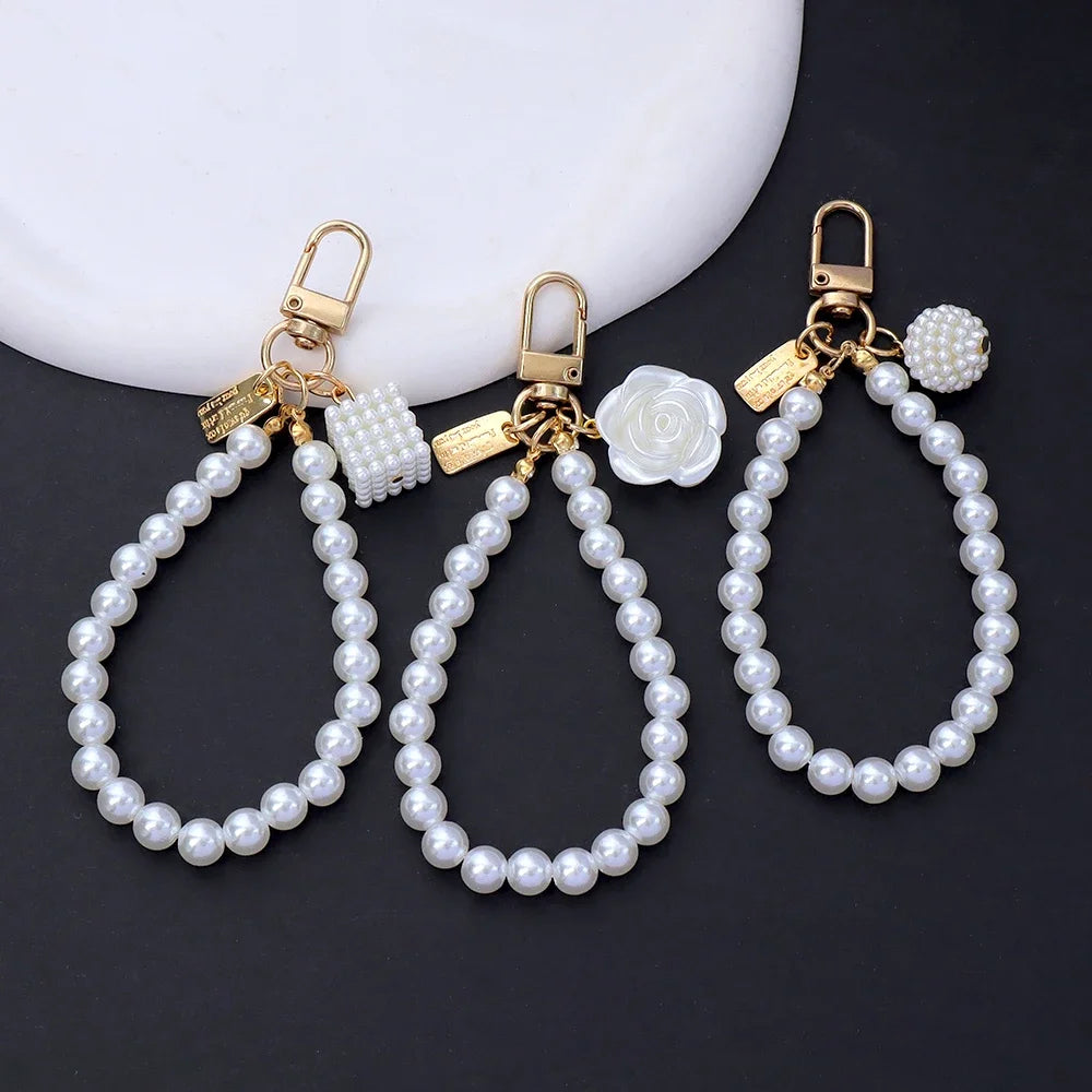 Fashion Rose Flower Bow Pendant Key Ring Anti-Loss Pearl Chain Wristband Keychain For Women Phone Handbag Ornament Party Gifts
