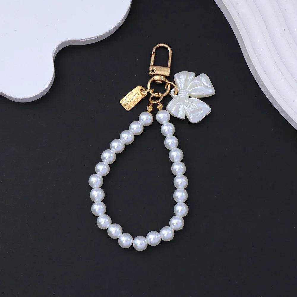 Fashion Rose Flower Bow Pendant Key Ring Anti-Loss Pearl Chain Wristband Keychain For Women Phone Handbag Ornament Party Gifts